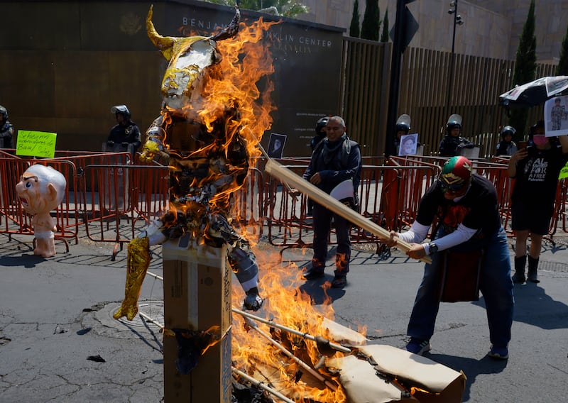 Muslims and members of the Iranian community in Mexico protest outside the U.S. Embassy in Mexico City, Mexico, on March 7, 2026, burning an image of Baal, an effigy of the Canaanite and Semitic deity, often depicted with a Star of David and symbols associated with Satanism. The protest is in response to the attacks carried out by the United States and Israel against Iran, which result in the death of Ayatollah Ali Khamenei, the Supreme Leader of the Islamic Republic. (Photo by Gerardo Vieyra/NurPhoto via Getty Images)