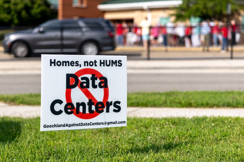 A sign opposing data centers can be seen outside Goochland High School as a rally is held, Thursday, July 23, 2026, in Goochland, Va.