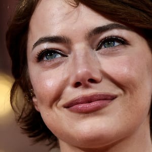 Emma Stone poses on the red carpet for the screening of the movie "Bugonia" in competition, at the 82nd Venice Film Festival