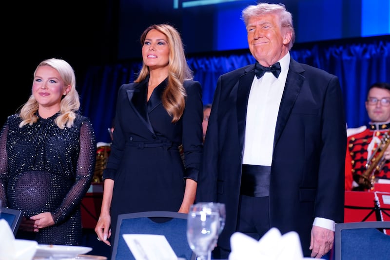 WASHINGTON, DC - APRIL 25: White House Press Secretary Karoline Leavitt, First Lady Melania Trump and U.S. President Donald Trump attend of the annual White House Correspondents Association Dinner April 25, 2026 in