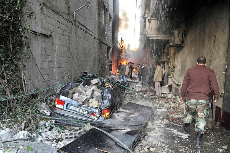 articles/2012/11/28/a-damascus-whodunit-syrian-bombings-kill-dozens/giglio-car-bombing-damascus-tease-embed_lb8afj