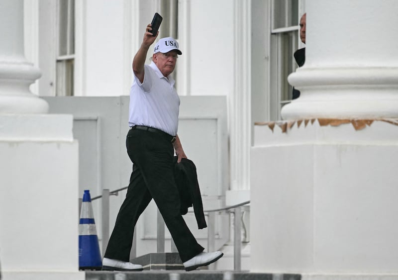 US President Donald Trump waving