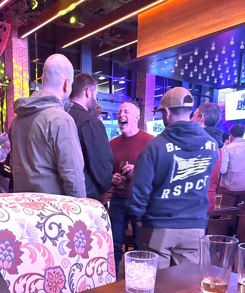 Bovino cackles as he chats to his young male friends.