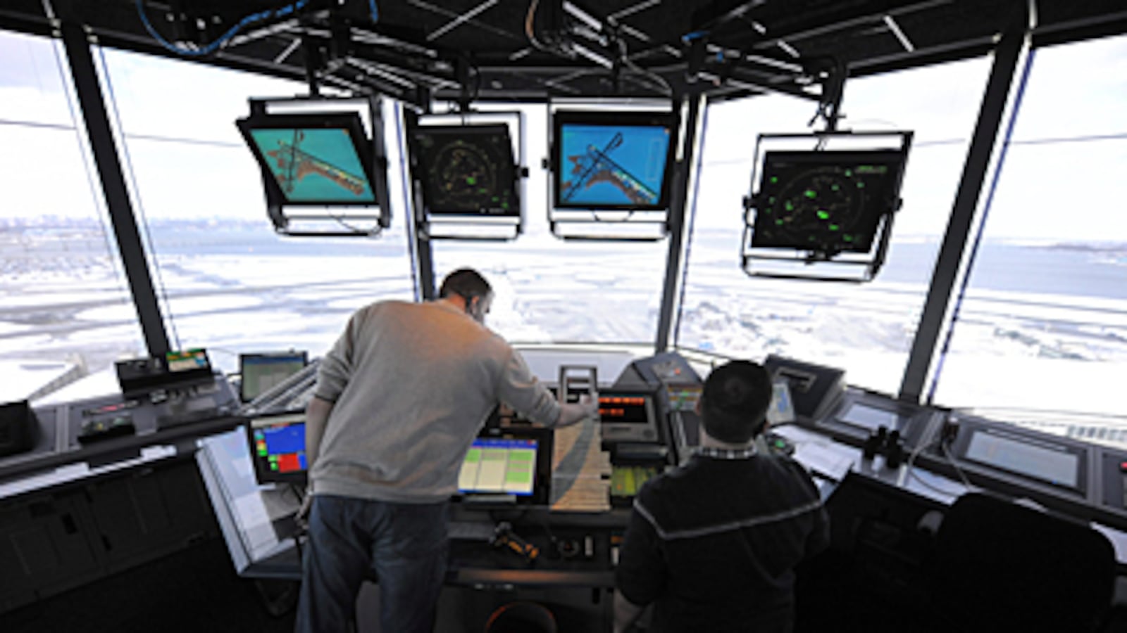 A library photo of air traffic controllers in the control tower at LaGuardia Airport in Queens, New York.
