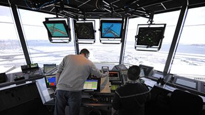 A library photo of air traffic controllers in the control tower at LaGuardia Airport in Queens, New York.