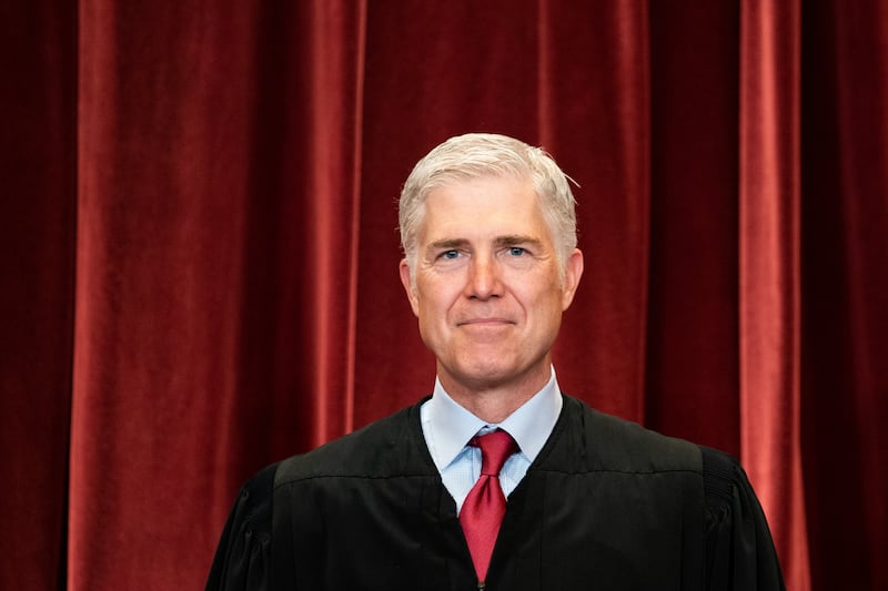 Neil Gorsuch stands during a group photo of the Justices at the Supreme Court in Washington, DC on April 23, 2021.