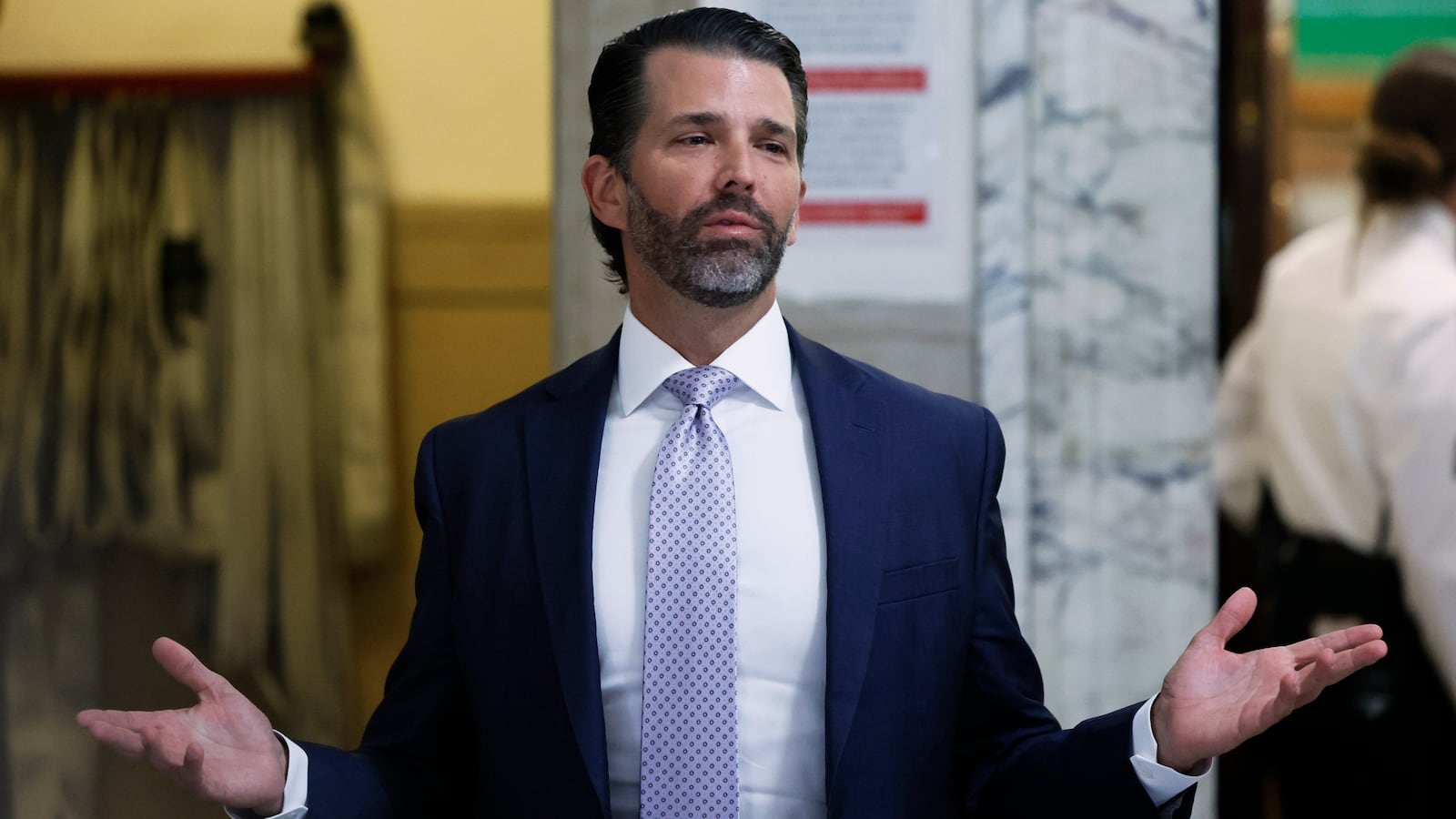 Donald Trump Jr. speaks as he leaves a courtroom onNovember 13, 2023 in New York City.