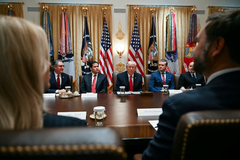 US President Donald Trump listens during a cabinet meeting in the Cabinet Room of the White House in Washington, DC, on January 29, 2026. Also pictured from L/R are Attorney General Pam Bondi, US secretary of Interior Doug Burgum, US Secretary of State Marco Rubio, US Secretary of Defense Pete Hegseth, Secretary of Commerce Howard Lutnick, and US Vice President JD Vance. (Photo by Brendan SMIALOWSKI / AFP via Getty Images)