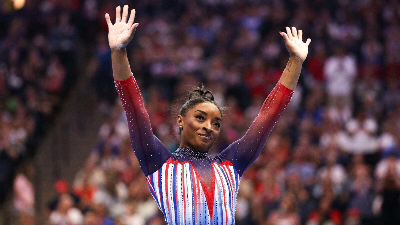 Simone Biles celebrates her floor routine during the U.S. Olympic Team Gymnastics Trials at Target Center.