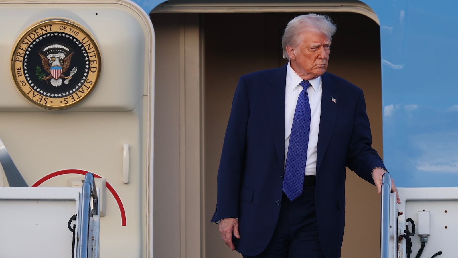 Donald Trump exits Air Force One.