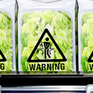 Bags of lettuce with warning label