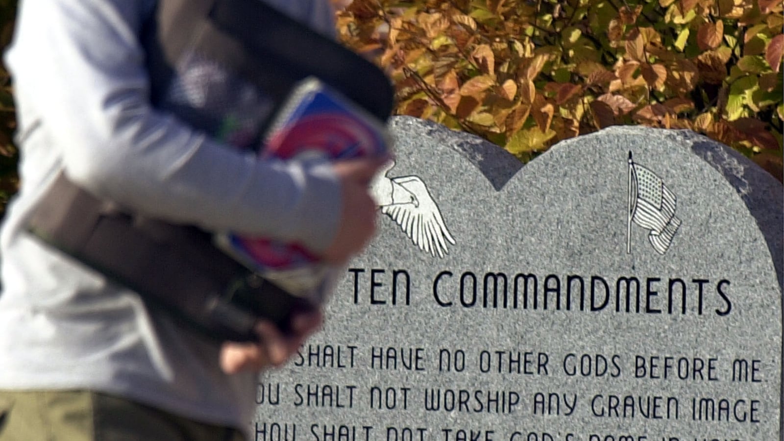 PEEBLES , OH - NOVEMBER 20: A student makes his way past a marker depicting the Ten Commandments is shown outside of Peebles High School November 20,2002 in Peebles, Ohio. A federal Appeals Court has ordered the school to remove the marker.
