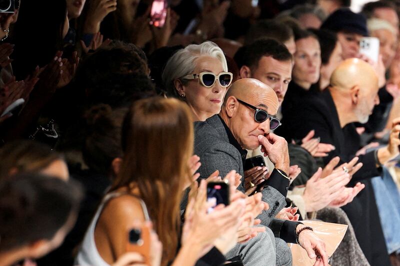 Meryl Streep and Stanley Tucci look on at the end of the Dolce & Gabbana spring/summer 2026 collection show during Fashion Week in Milan, Italy, September 27, 2025