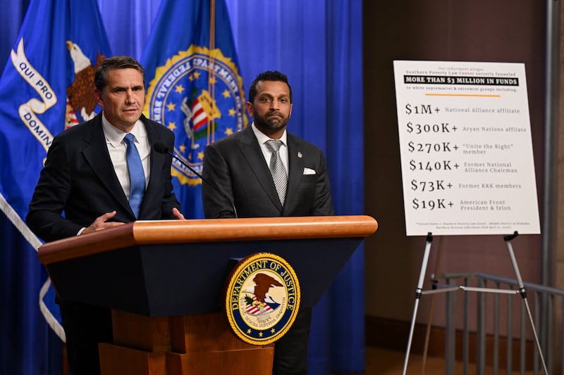 Acting U.S. Attorney General Todd Blanche speaks as Federal Bureau of Investigation (FBI) Director Kash Patel stands by his side during a press conference at the Department of Justice in Washington, D.C., U.S., April 21, 2026.