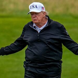 TURNBERRY, SCOTLAND - JULY 27: U.S. President Donald Trump reacts as he plays a round of golf at Trump Turnberry golf course during his visit to the UK on July 27, 2025 in Turnberry, Scotland. U.S. President Donald Trump is visiting his Trump Turnberry golf course, as well as Trump International Golf Links in Aberdeenshire, during a brief visit to Scotland from July 25 to 29.  (Photo by Christopher Furlong/Getty Images)