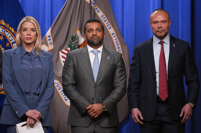 WASHINGTON, DC - DECEMBER 04: Attorney General Pam Bondi (L), FBI Director Kash Patel (C) and FBI Deputy Director Dan Bongino hold a news conference about the January 6th pipe bomber at the Department of Justice on December 4, 2025 in Washington, DC. Federal agents have arrested a suspect they are charging with placing two pipe bombs, which never exploded, the night before the January 6th, 2021 U.S. Capitol attack. (Photo by Andrew Harnik/Getty Images)