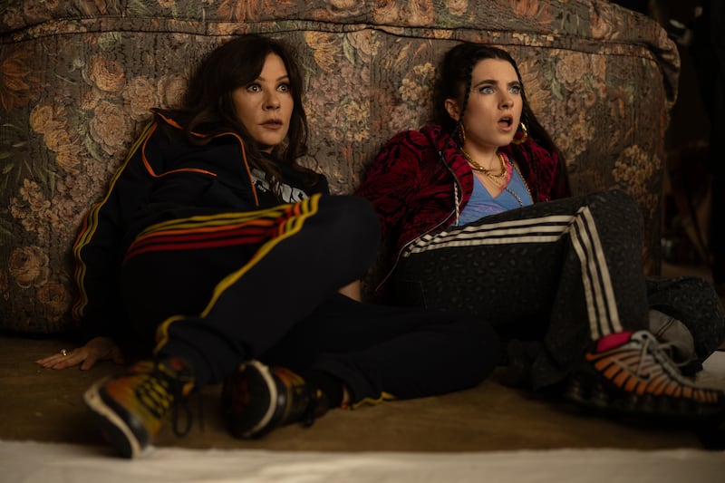 Catherine Zeta-Jones as Jackie Price and Darci Shaw as Gwen.