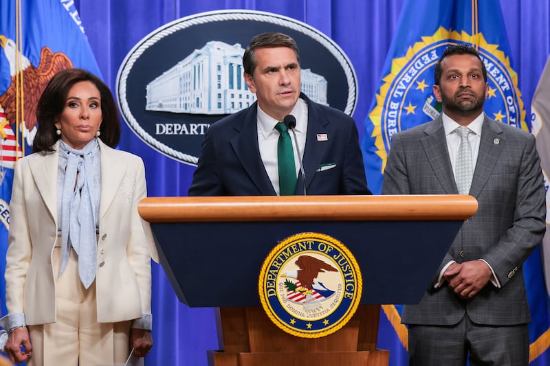Acting Attorney General Todd Blanche speaks, with U.S. Attorney for the District of Columbia Jeanine Pirro and U.S. Federal Bureau of Investigation (FBI) Director Kash Patel behind him, during a press conference about the shooting that happened at the White House Correspondents' Association dinner where U.S. President Donald Trump was present, at the U.S. Department of Justice in Washington, D.C., on April 27, 2026.