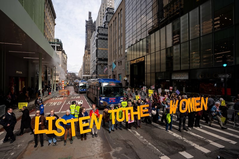 People protest outside Trump Tower during a "Believe Survivors" demonstration against U.S. President Donald Trump on International Women's day in New York City, U.S., March 8, 2026.