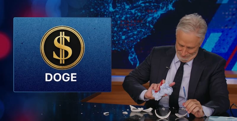 Jon Stewart looking at his bloody hand after prop accident