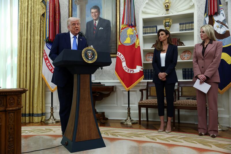 U.S. President Donald Trump speaks next to U.S. Attorney General Pam Bondi and Alina Habba during a swearing-in ceremony for Habba as interim U.S. Attorney for the District of New Jersey, in the Oval Office at the White House in Washington, D.C., U.S., March 28, 2025. REUTERS/Evelyn Hockstein