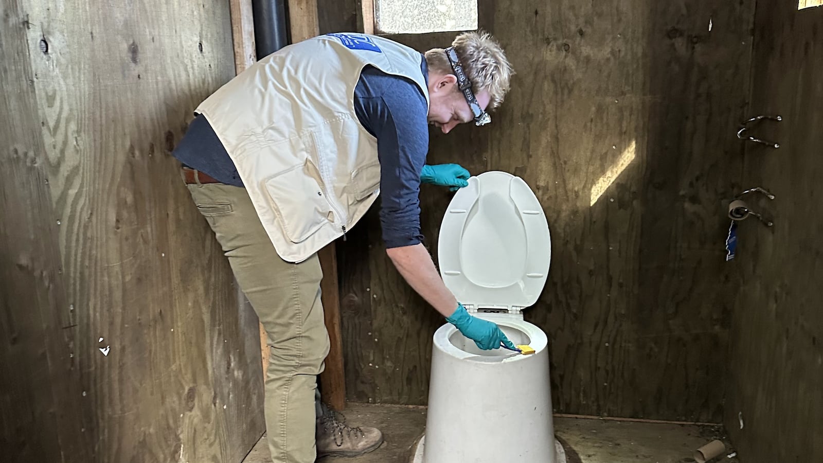 Epidemic Intelligence Service officer Arran Hamlet swabs a backcountry pit latrine in Government Meadows, Washington State, for norovirus sampling during an investigation into a gastrointestinal illness outbreak among Pacific Crest Trail hikers, 2022. Image courtesy CDC. (Photo by Smith Collection/Gado/Getty Images)