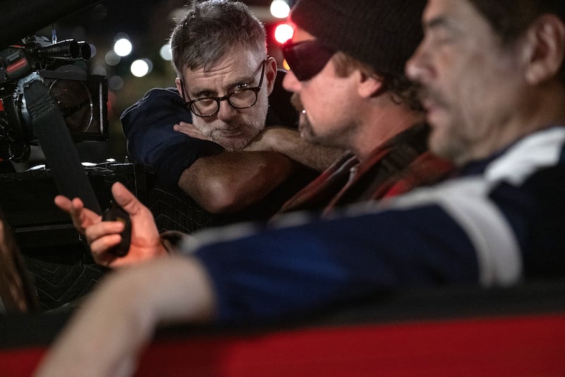 Paul Thomas Anderson, Leonardo Di Caprio, and Benicio Del Toro on the set of “One Battle After Another.”