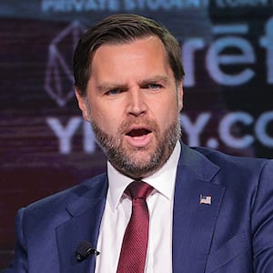 U.S. Vice President JD Vance (R) speaks with Turning Point USA spokesperson Andrew Kolvet during a Turning Point USA event at Akins Ford Arena at the Classic Center on April 14, 2026 in Athens, Georgia.