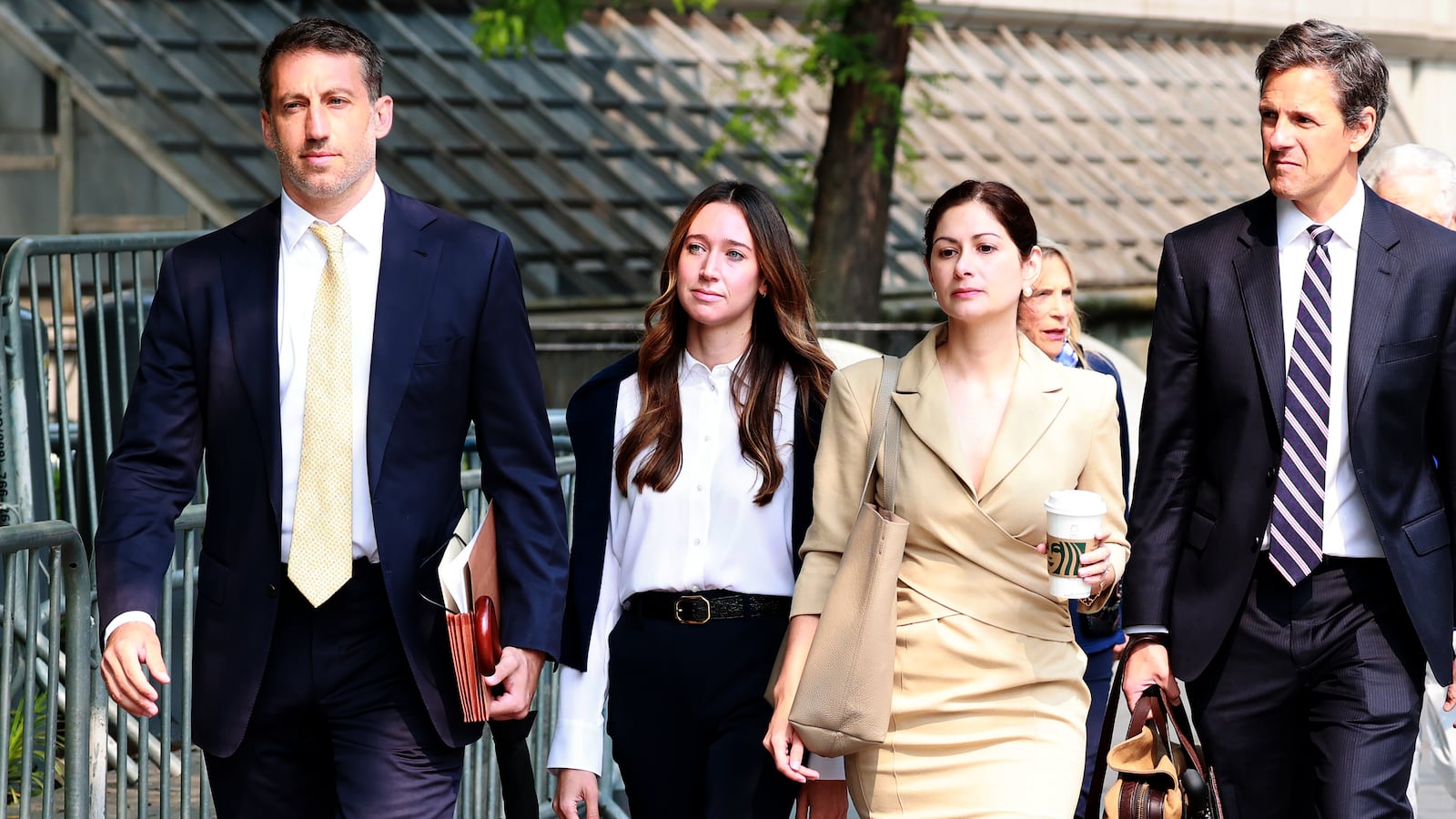 Charlie Javice (Left wearing white blouse) and her advisors arrive at Manhattan Federal Court Southern District early Tuesday.
