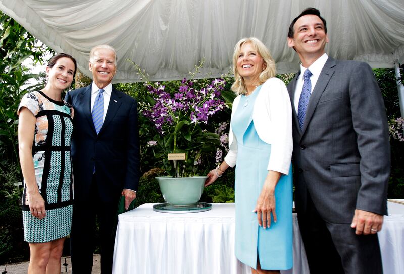 Joe Biden (2nd L) and his wife Jill Biden (2nd R), pose for a photo with their daughter Ashley and son-in-law Dr. Howard Krein at the National Orchid Garden in Singapore July 26, 2013.