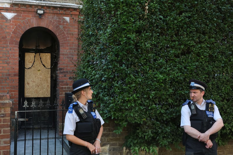Police officers stand outside Britain's Prime Minister Keir Starmer's private home, after it was damaged by fire in a suspected arson attack in north London, Britain, May 13, 2025. REUTERS/Toby Melville