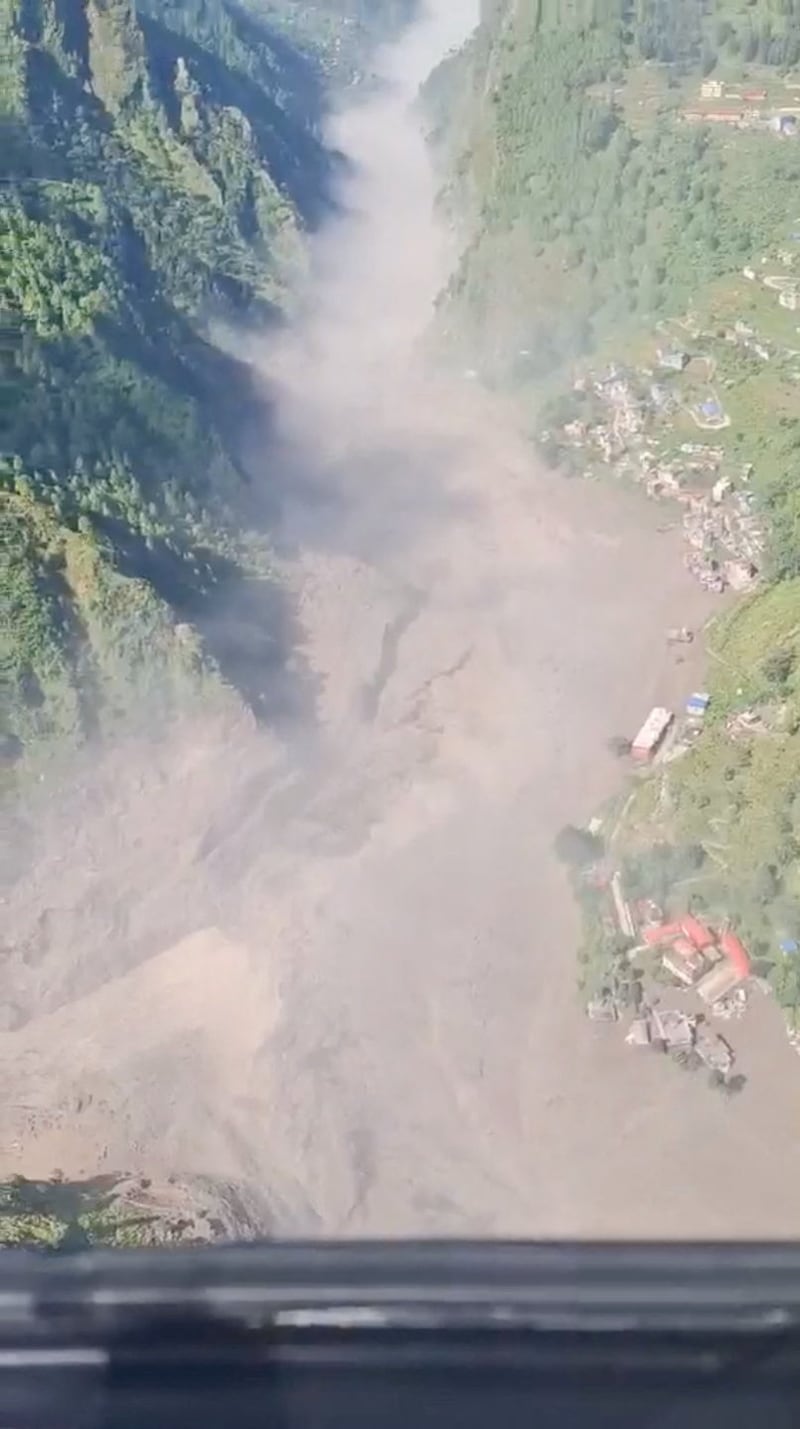Helicopter footage shows flash flooding in the valleys in Rasuwa, Nepal, August 26, 2026, in this screengab taken from a handout video.    Altitude Air/Handout via REUTERS    THIS IMAGE HAS BEEN SUPPLIED BY A THIRD PARTY. NO RESALES. NO ARCHIVES. MANDATORY CREDIT.  VERIFICATION: - Buildings, roads and terrain match satellite imagery of the area - Date confirmed by authorities in Nepal saying massive flash flood hit Syapru Besi and Timure in Rasuwa, Nepal - Corroborating videos of the same incident also showed waters flooding the valley