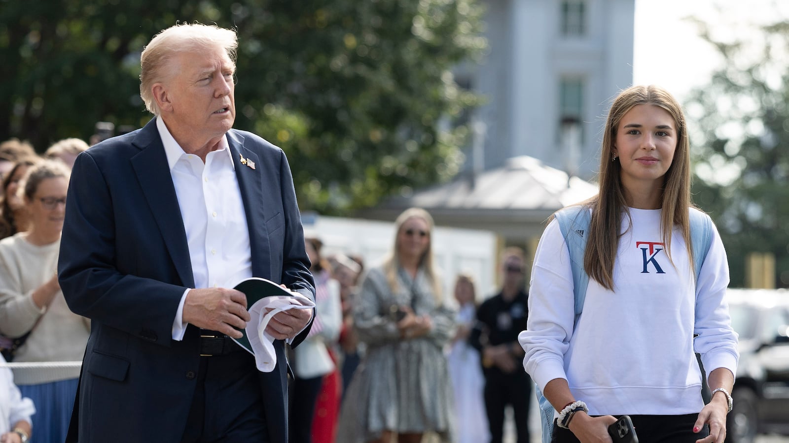 WASHINGTON, DC - SEPTEMBER 26: U.S. President Donald Trump, joined by his granddaughter Kai Trump, departs the White House on September 26, 2025 in Washington, DC. Under pressure from Trump, the DOJ indicted former FBI Director James Comey on counts of making false statements and obstruction of a congressional proceeding related to the September 2020 Russia investigation. (Photo by Kevin Dietsch/Getty Images)