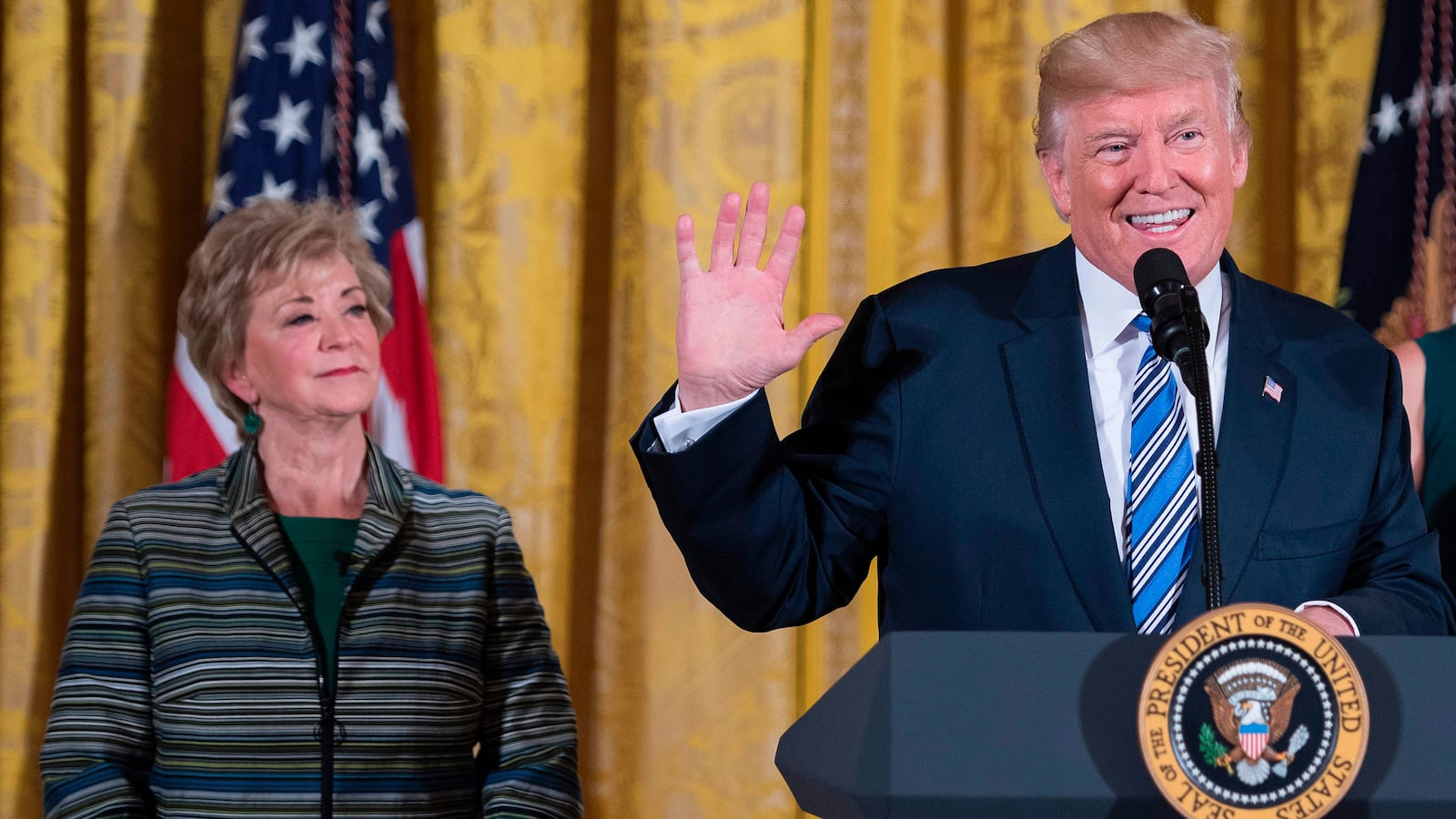 US President Donald Trump speaks with Ivanka Trump and SBA Administrator Linda McMahon (L) during an event with small businesses at the White House in Washington, DC, on August 1, 2017. / AFP PHOTO / JIM WATSON (Photo credit should read JIM WATSON/AFP via Getty Images)