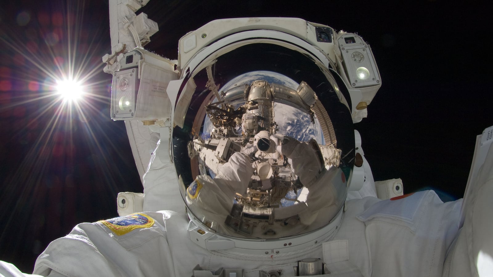 Photo by Japanese astronaut Akihiko Hoshide of himself during a spacewalk outside the International Space Station.