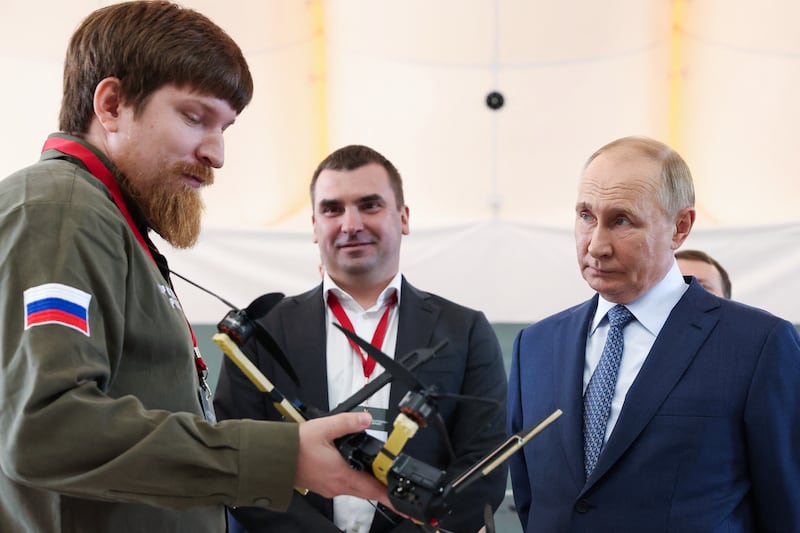 In this pool photograph taken on September 19, 2024 and distributed by the Russian state agency Sputnik, Vladimir Tkachuk, co-founder of Yekaterinburg-based drone manufacturer Uraldronzavod, demonstrates a drone to Russian President Vladimir Putin during the Russian leader's visit to the Special Technology Centre in Saint Petersburg. The CEO of a Russian drone factory has been seriously wounded in a "car explosion", Russian state media reported on August 5, 2026, in what appeared to be a second assassination attempt on a Russian defence official in days. (Photo by Valery SHARIFULIN / POOL / AFP via Getty Images)