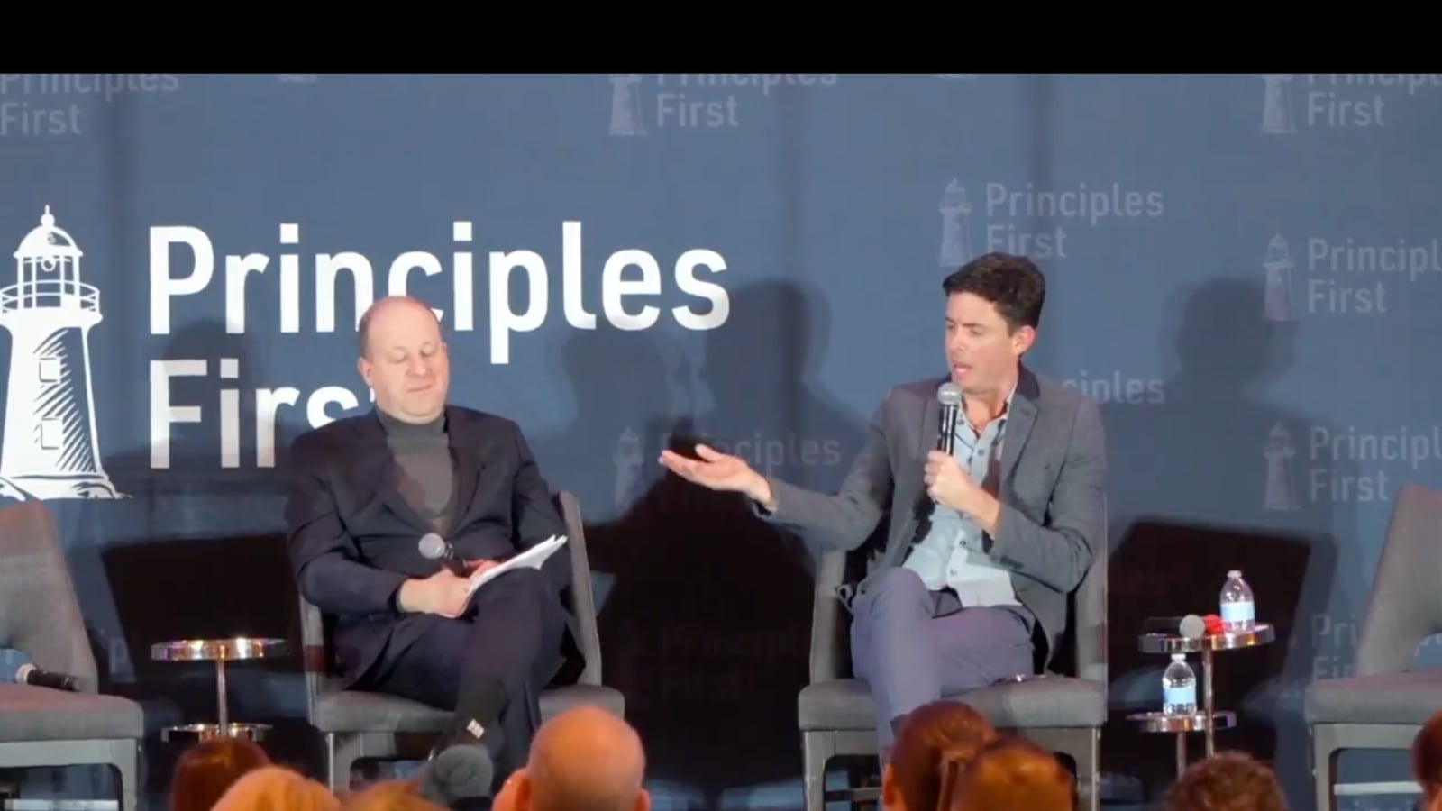 Colorado Governor Jared Polis and conservative political strategist Tim Miller of The Bulwark speak at the Principles First Summit on February 23, 2025.