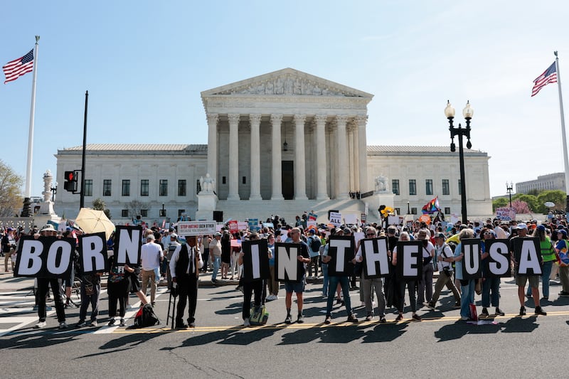 Demonstrators rally in support of birthright citizenship outside the US Supreme Court as President Donald Trump attends oral arguments in Washington, DC on April 1, 2026. President Donald Trump is watching in person as the US Supreme Court hears a landmark case weighing the constitutionality of his contentious bid to end birthright citizenship, an extraordinary and possibly unprecedented move for the nation's highest office.