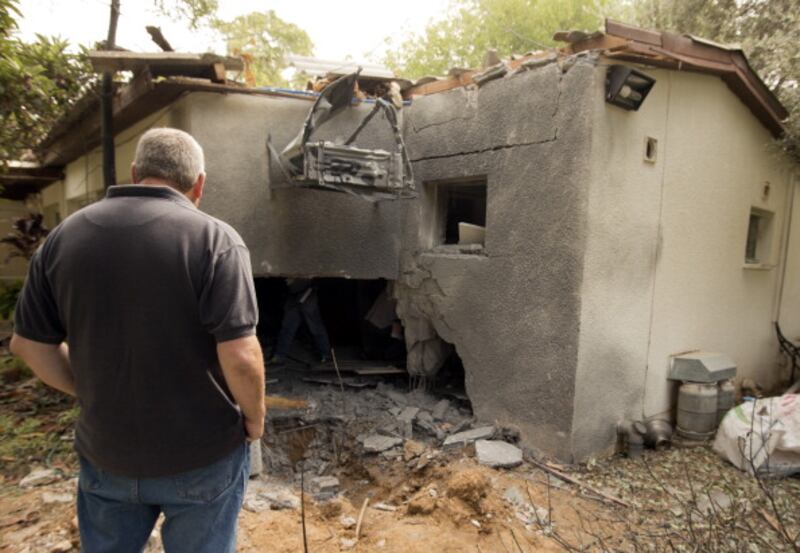 articles/2012/11/02/war-and-elections/rocket-gaza-openz_qswmti