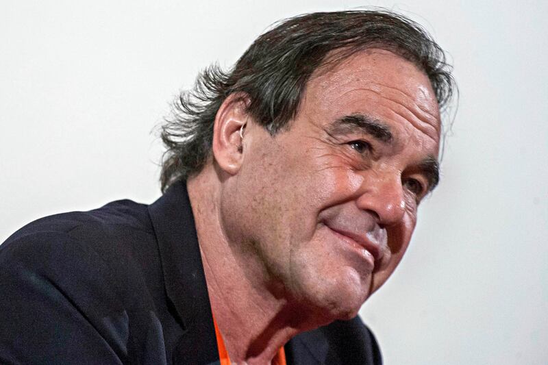 galleries/2012/10/10/lady-gaga-mia-more-star-supporters-of-julian-assange-photos/stone-julian-assange-celeb-supporters_cd7pma