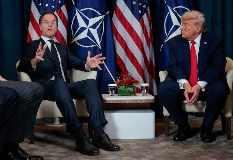 President Donald Trump listens as NATO Secretary General Mark Rutte speaks during a bilateral meeting on the sidelines of the World Economic Forum Annual Meeting on January 21, 2026 in Davos, Switzerland.