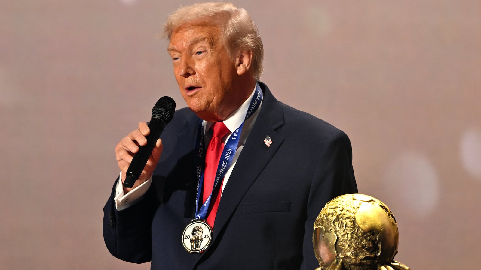 U.S. President Donald Trump speaks as he receives the FIFA Peace Prize.