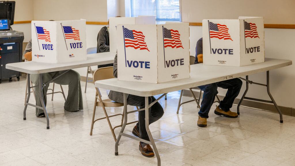 Voters fill out their ballots.