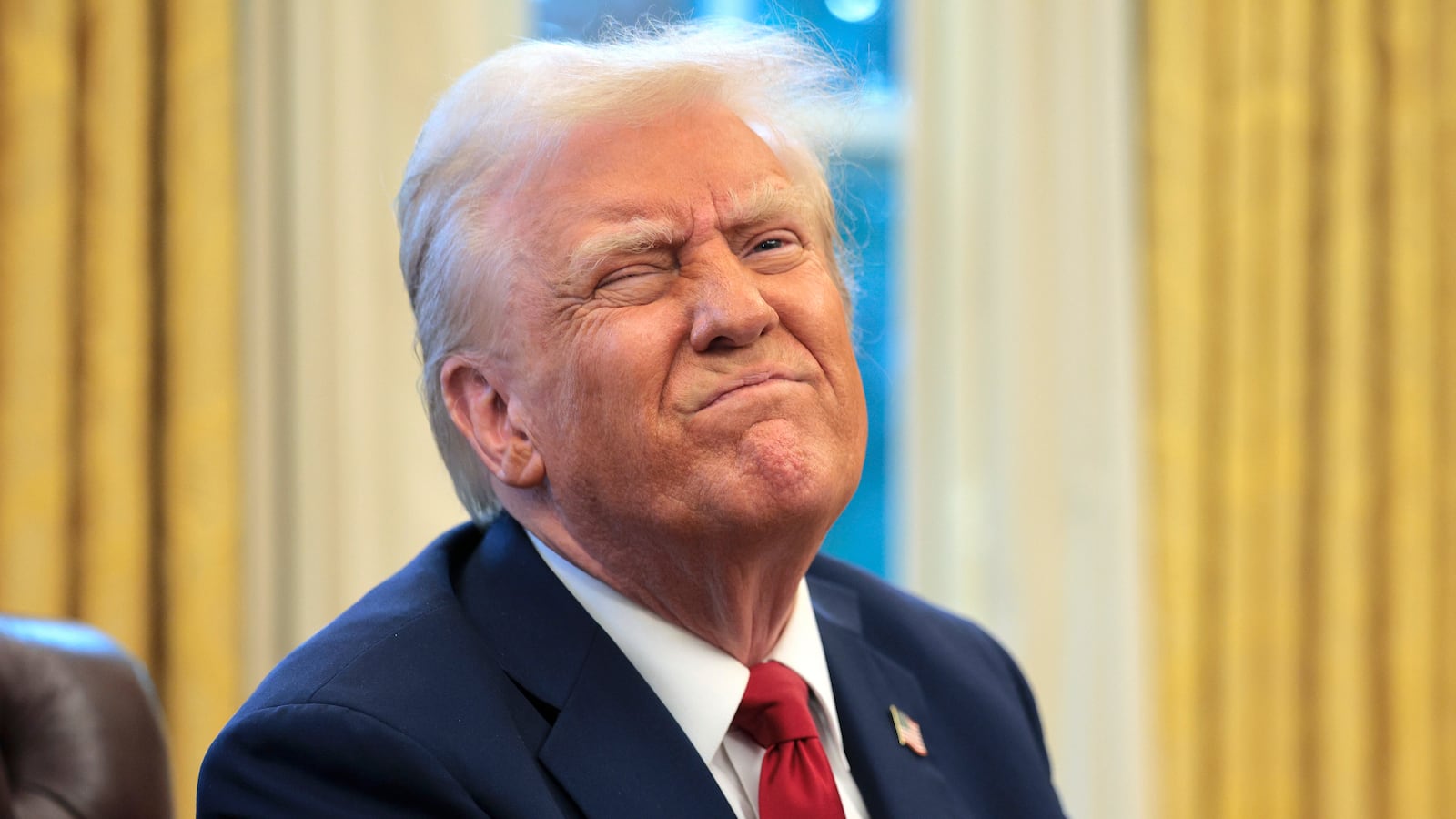 U.S. President Donald Trump reacts to a reporter's question from the Resolute Desk after signing an executive order to appoint the deputy administrator of the Federal Aviation Administration in the Oval Office at the White House on January 30, 2025 in Washington, DC.