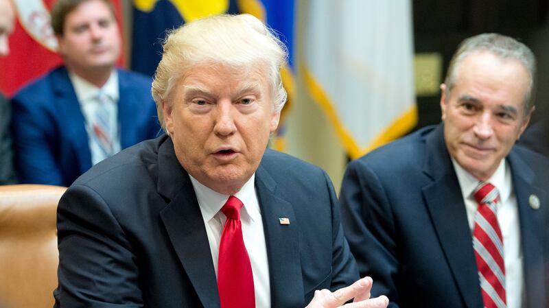 WASHINGTON, D.C. - FEBRUARY 16:  (AFP-OUT) President Donald Trump participates in a congressional listening session with GOP members in the Roosevelt Room of the White House February 16, 2017 in Washington, DC.  Also pictured is Rep. Chris Collins (R-NY).