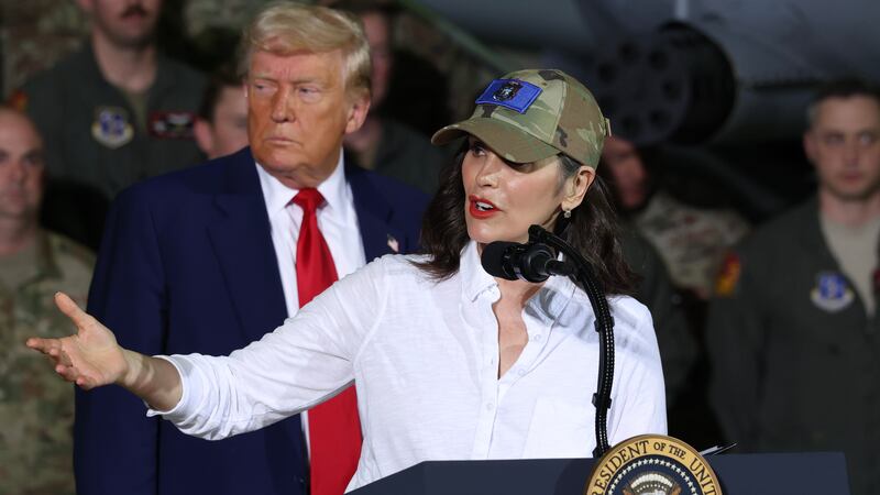 President Donald Trump listens as Michigan Gov. Gretchen Whitmer speaks during a visit with Michigan Air National Guard Troops on April 29, 2025 at Selfridge Air National Guard Base.