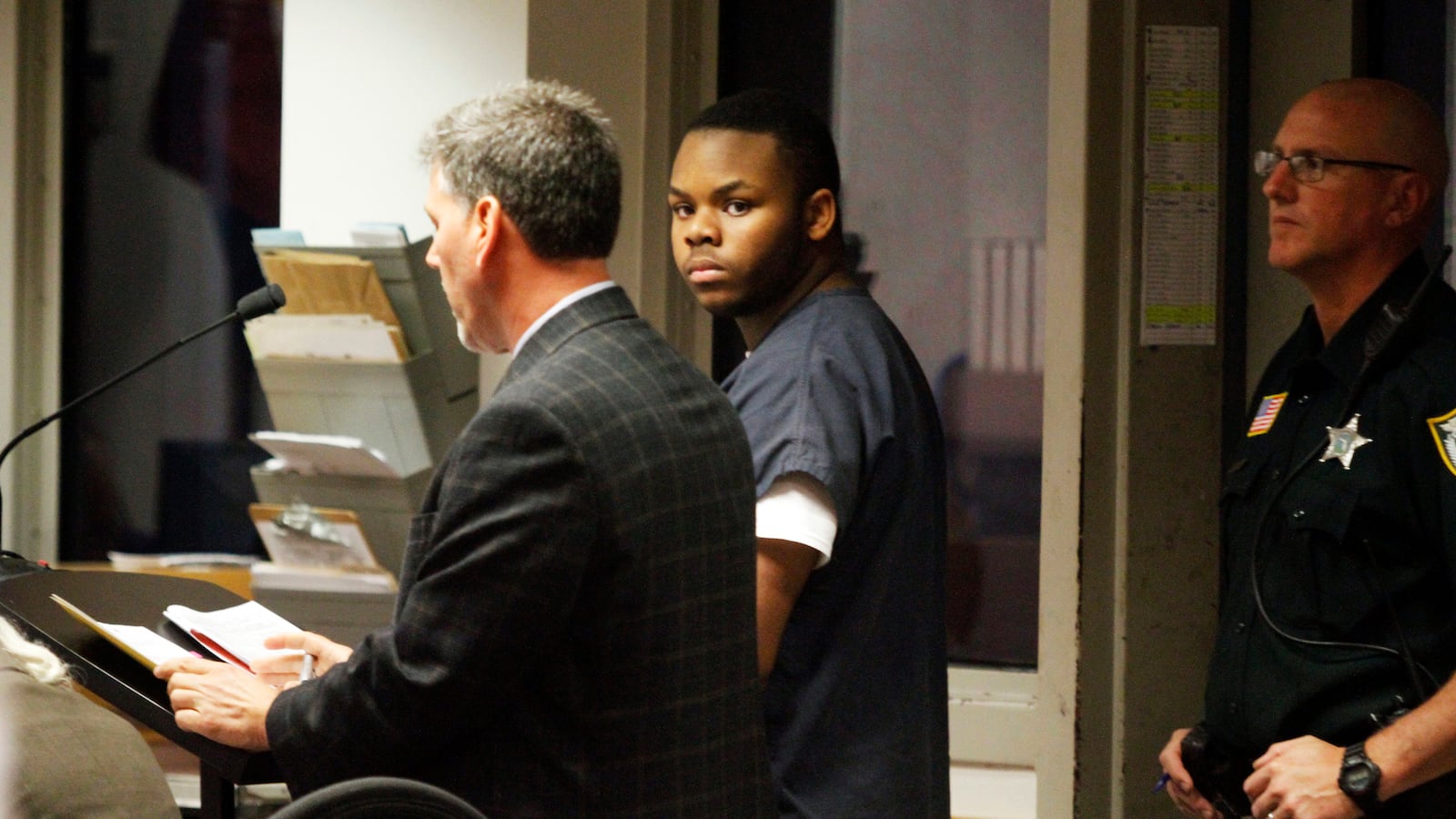 Malachi Love-Robinson of West Palm Beach, Fla., looks over at his grandfather during his first appearance court hearing on March 2, 2016.
