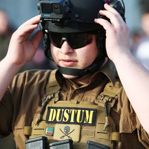 A photo of Adam Kadyrov in tactical shooting equipment.