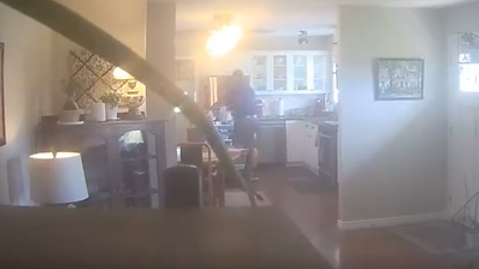 Real estate agent Mike Rose helping himself to a seller’s milk in Kamloops, Canada.