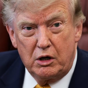 U.S. President Donald Trump answers questions from the media after signing an executive order establishing the President's Military Spouse Commission to be chaired by Jennifer Rauchet, wife of Secretary of Defense Pete Hegseth, in the Oval Office at the White House in Washington, D.C., U.S., August 3, 2026. REUTERS/Evelyn Hockstein